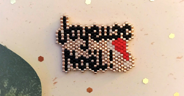 Broche Joyeux Noël en tejido de punto de ladrillo por MamZelle Lulu