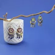 Entrepieza calada con forma de sol 15 mm dorado rosa x1