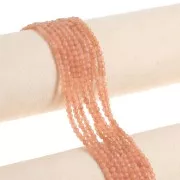 Redondas aplanadas facetadas 4x3 mm de Quartz teñida- Naranja Claro x35cm