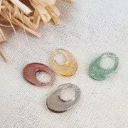 Colgante ovalado calado de acrílico 20x14 mm - Marrón transparente x1