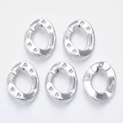 Eslabón acrílico ovalado retorcido 26x21 mm para cabujón 1088 1,8 mm - Plateado x1