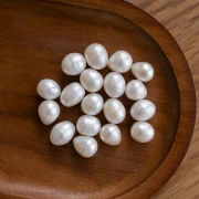 Perla de Agua Dulce Oval Irregular 11x10 mm - Grado A Blanca x1