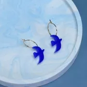 Dije de pájaro acrílico 15x10 mm exclusivo de Perles&Co - Plateado brillo x1