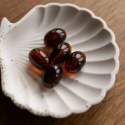 Cuenta con forma de oliva 21x15 mm en resina translúcida - Ámbar jaspeado x1