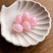 Cuenta con forma de oliva 21x15 mm en resina translúcida - Rosa claro jaspeado x1