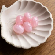 Cuenta con forma de oliva 21x15 mm en resina translúcida - Rosa claro jaspeado x1