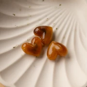 Cuenta corazón resina translúcida 15.5x18mm - agujero horizontal - Albaricoque jaspeado x1