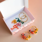 Mi bisutería DIY - Versión naranja del kit criollo de flores giratorias de perlas