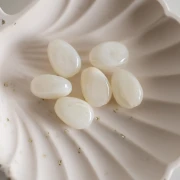 Cuentas acrílicas planas irregulares 18x13 mm - Marfil jaspeado x10