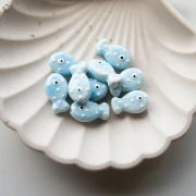 19x11,5 mm Perla pez de cerámica - Azul cielo - Blanca x1