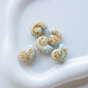 Cuenta de cerámica de concha de caracol 21x16 mm - Azul - Oro x1