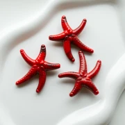 Perla acrílica estrella de mar 37x43 mm - Rojo - Negro jaspeado x1
