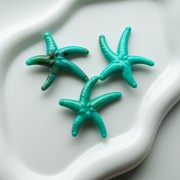 Perla acrílica estrella de mar 37x43 mm - Turquesa - Marrón jaspeado x1