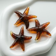 Colgante estrella de mar, 49x45 mm, acrílico - Marrón jaspeado x1
