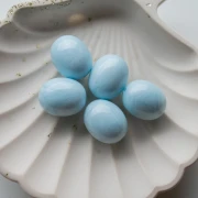 Cuenta con forma de oliva de 21 x 17 mm de resina opaca - Efecto marmolado azul claro x1
