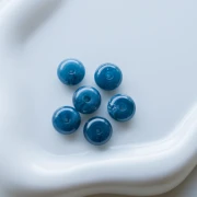 Cuentas redondas 12x7 mm en resina opaca - Azul petróleo jaspeado x6