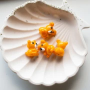 Cuenta osito de vidrio 19x14 mm - Naranja jaspeado x1