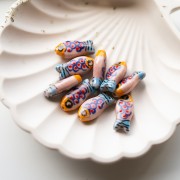 Cuenta pez de cerámica 21x10 mm - Rosa - Naranja - Azul x1