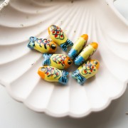 Cuenta pez de cerámica 21x11 mm - Amarillo - Naranja - Azul x1