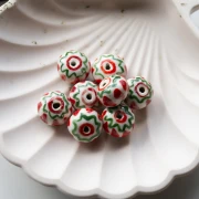 Cuenta redonda de cerámica 15x10,5 mm - Roja - Verde x1