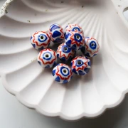 Cuenta redonda de cerámica 15x10,5 mm - Azul oscuro - Rojo x1