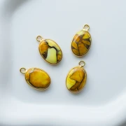 Dije ovalado de 18 x 11 mm de piedra preciosa - Turquesa Oyster Amarilla x1