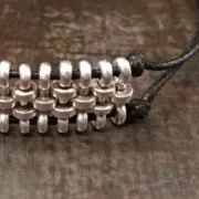 Componente con dos arandelas 12mm para cordones de 1.5mm plateado antiguo