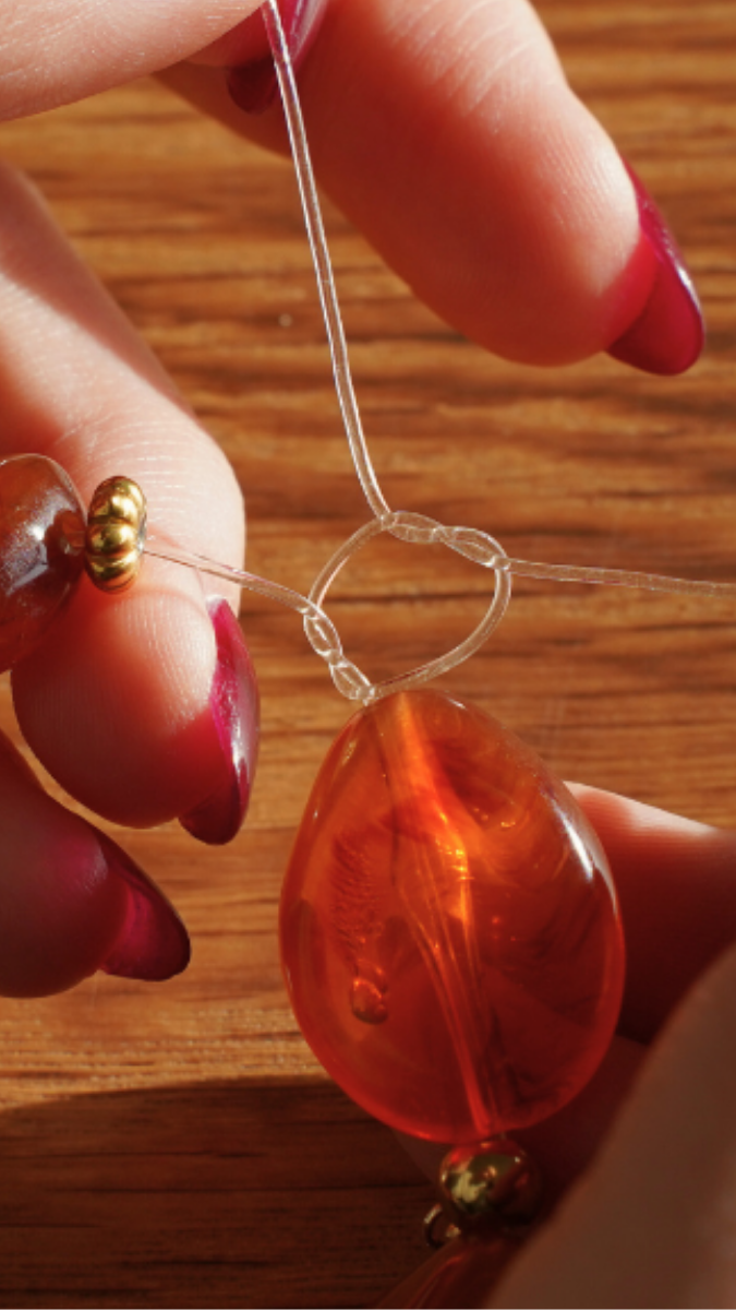 Esquema Cómo hacer una pulsera con hilo elástico