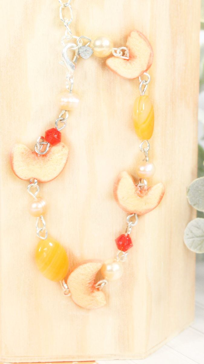 Esquema Pulsera de cuentas y melocotón mixto de arcilla polimérica
