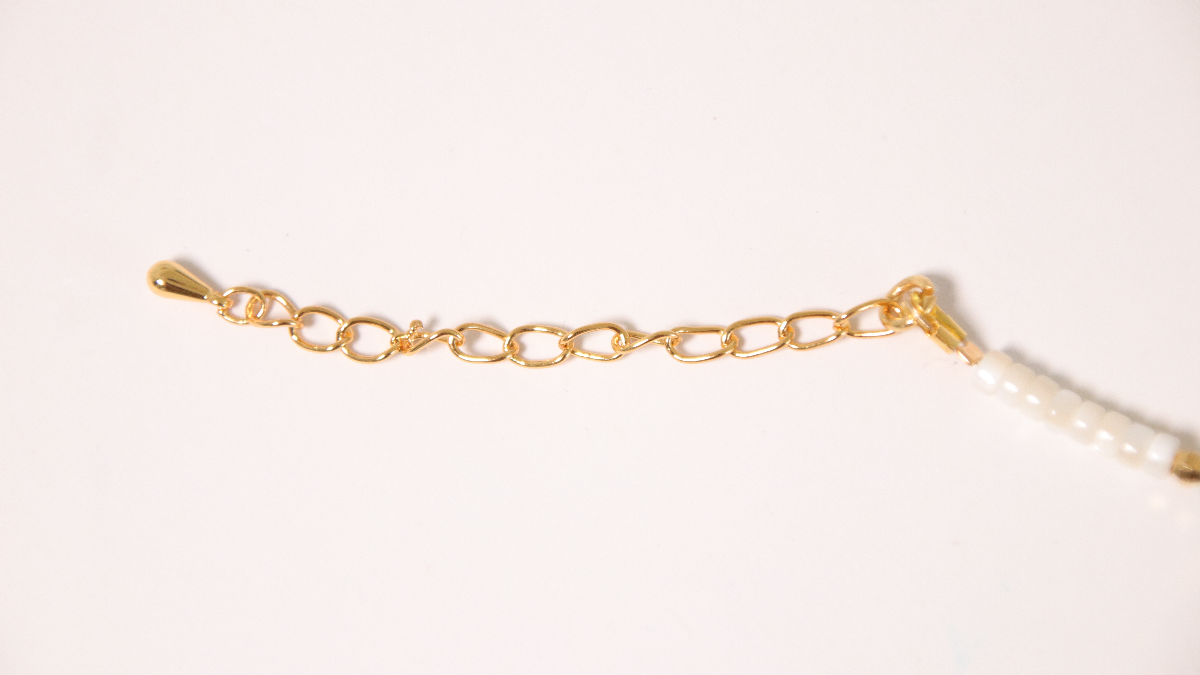 DIY Pulsera de perlas de estrella de oro y turquesa : Paso 4