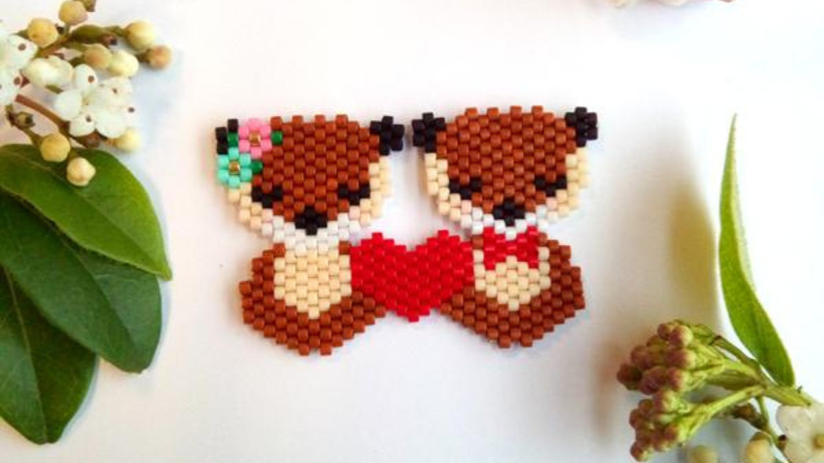 Tejiendo par de costuras de ladrillos en amor nutrias Valentine